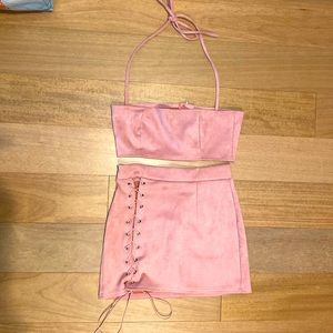 Pink- Two piece mini skirt with tube top that ties. Size medium.